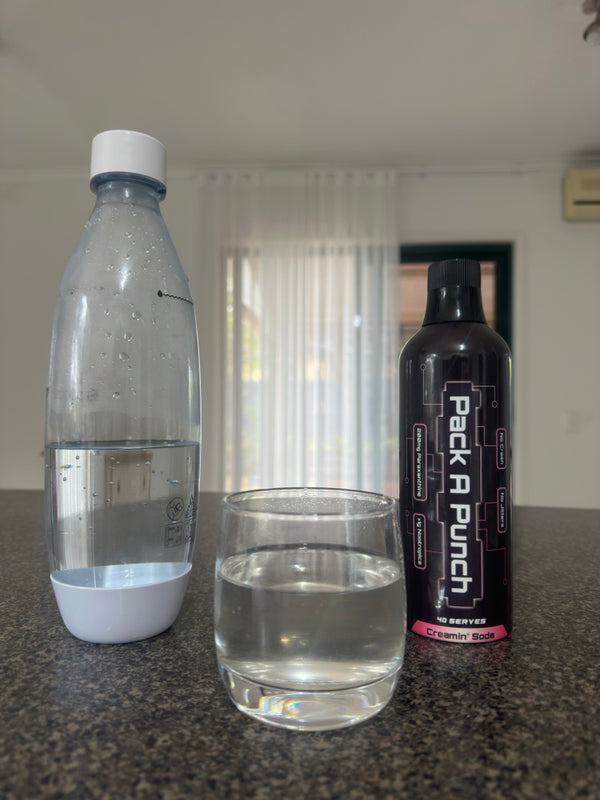Pouring a capful of Pack A Punch nootropic energy concentrate