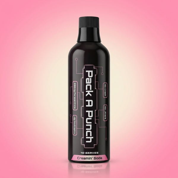 Pack A Punch Creamin' Soda 500ml paraxanthine nootropic liquid concentrate bottle on pink studio backdrop